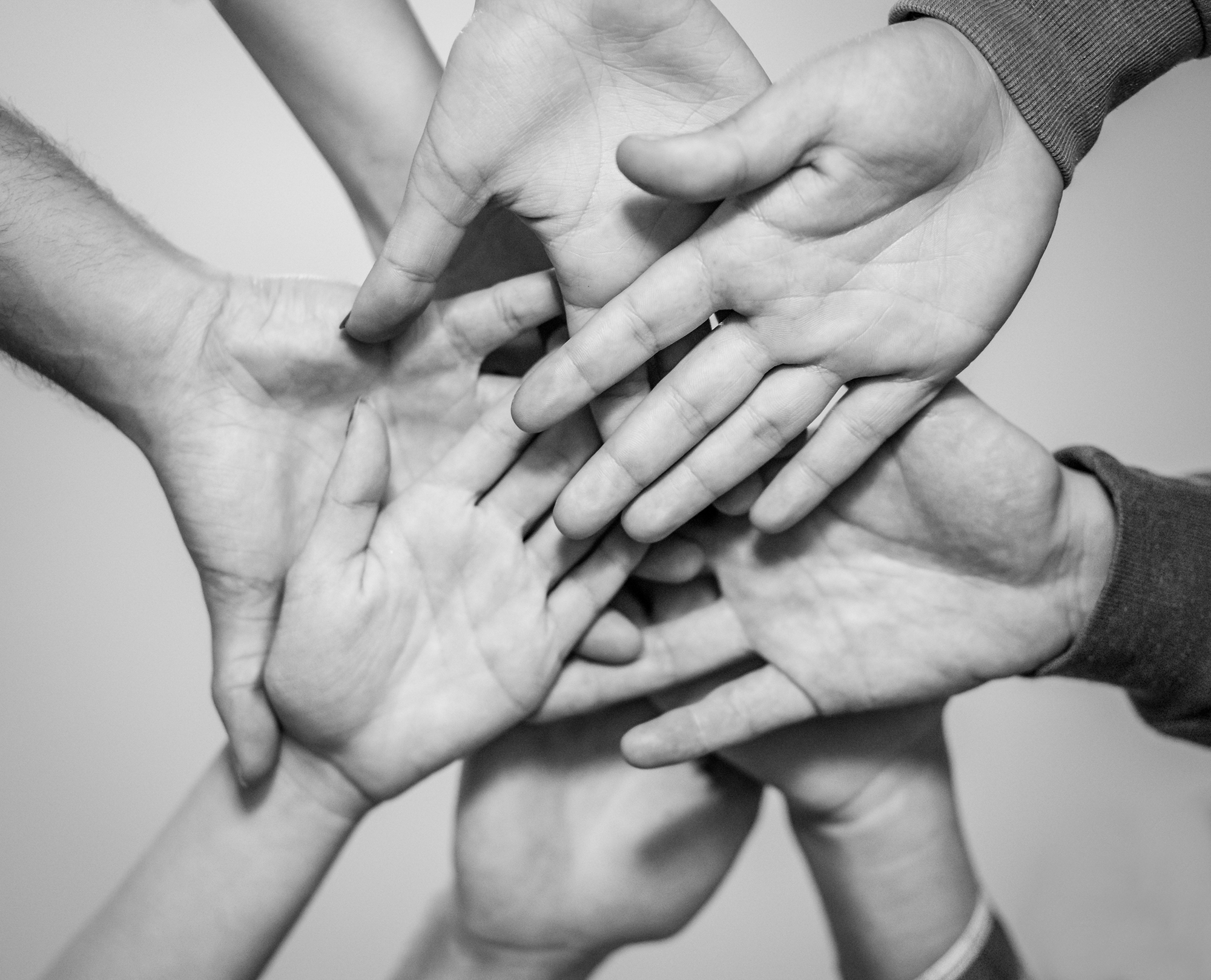 Maxim Pixel team - hands together in collaboration